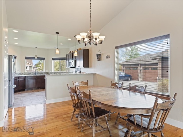 50 Pattee Trl, Bozeman, MT 59718 - dining space with a chandelier, light wood-style floors, recessed lighting, baseboards, and high vaulted ceiling