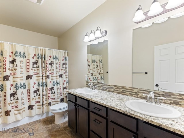 50 Pattee Trl, Bozeman, MT 59718 - bathroom with toilet, double vanity, decorative backsplash, and a shower with curtain
