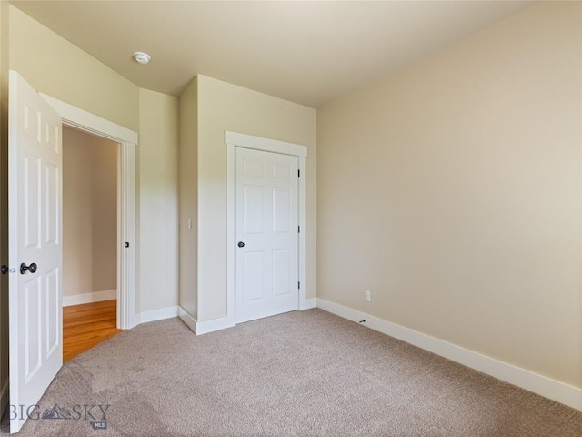 50 Pattee Trl, Bozeman, MT 59718 - unfurnished bedroom featuring light carpet and baseboards