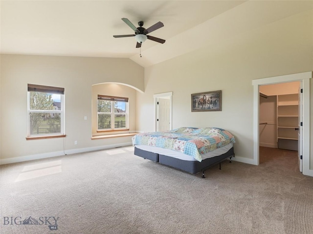 50 Pattee Trl, Bozeman, MT 59718 - bedroom featuring carpet, a spacious closet, baseboards, lofted ceiling, and ceiling fan