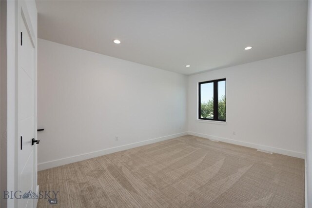 1745 Windward Ave Unit A, Bozeman, MT 59718 - spare room with light colored carpet, recessed lighting, and baseboards