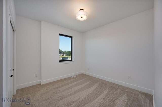 1745 Windward Ave Unit A, Bozeman, MT 59718 - unfurnished room featuring light carpet and baseboards