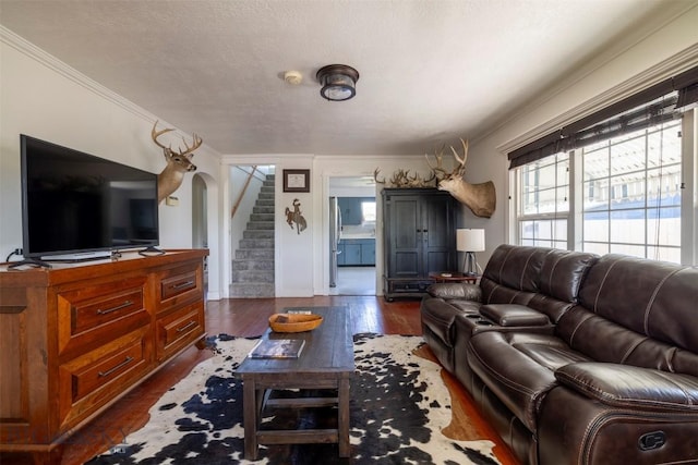 411 W Railroad Ave N, Manhattan, MT 59741 - living room featuring stairs, crown molding, dark wood finished floors, and baseboards