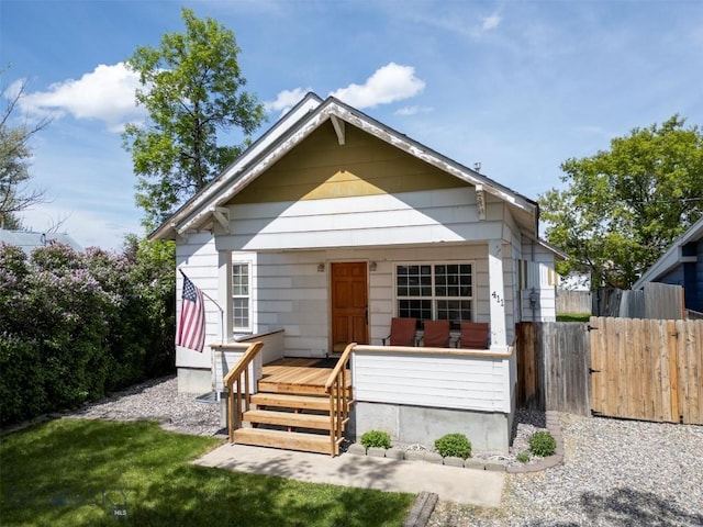 411 W Railroad Ave N, Manhattan, MT 59741 - shotgun-style home with a gate