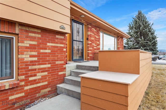 2040 Adams, Butte, MT 59701 - doorway to property featuring brick siding