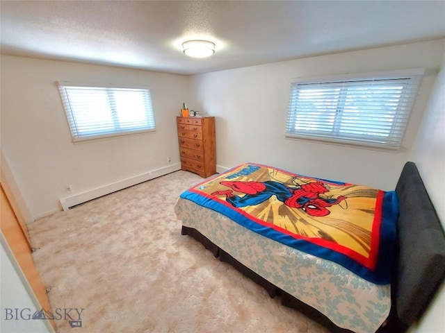 2040 Adams, Butte, MT 59701 - carpeted bedroom featuring multiple windows, baseboard heating, and baseboards