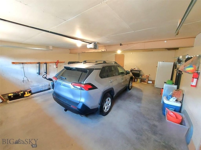 2040 Adams, Butte, MT 59701 - garage featuring a garage door opener
