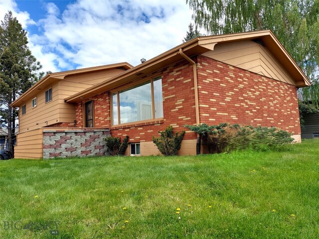 2040 Adams, Butte, MT 59701 - view of side of home featuring a yard and brick siding