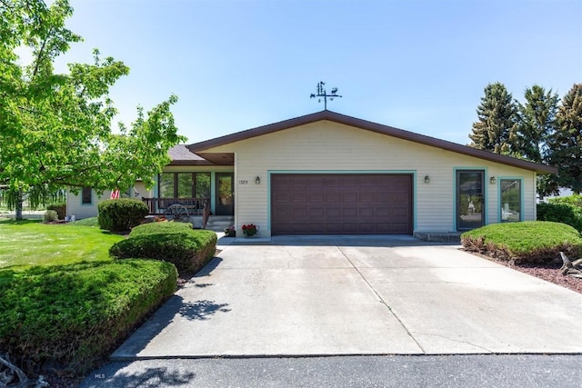 1385 Baldy Mountain Ln, Belgrade, MT 59714 - single story home featuring an attached garage, driveway, covered porch, and a front yard