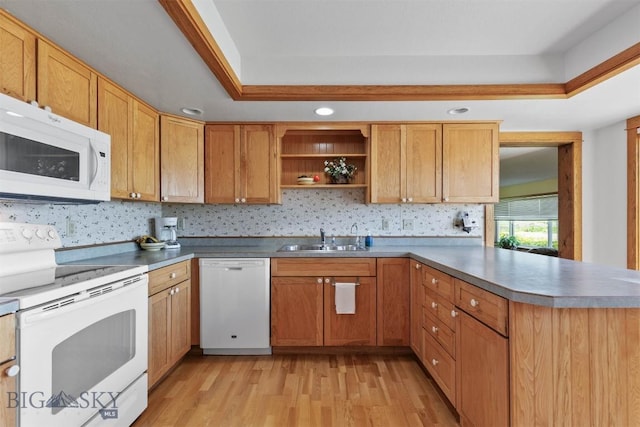 1385 Baldy Mountain Ln, Belgrade, MT 59714 - kitchen with white appliances, a sink, a peninsula, light wood-type flooring, and open shelves