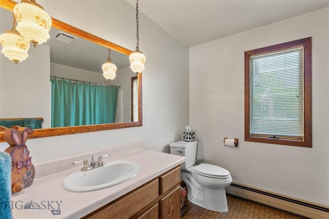 1385 Baldy Mountain Ln, Belgrade, MT 59714 - bathroom with a baseboard radiator, vanity, toilet, a shower with curtain, and tile patterned floors
