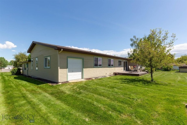 1385 Baldy Mountain Ln, Belgrade, MT 59714 - rear view of house featuring a yard, a deck, and an attached garage