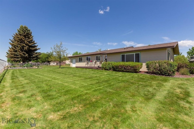 1385 Baldy Mountain Ln, Belgrade, MT 59714 - back of property with a wooden deck