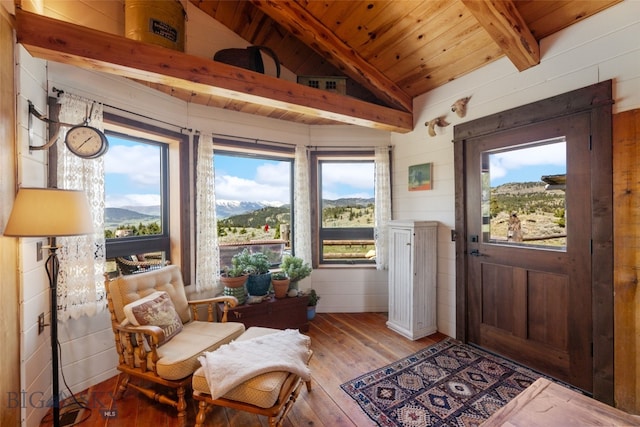 125 Rocky Mountain Mdws, Bozeman, MT 59715 - foyer entrance featuring wood-type flooring, plenty of natural light, wood ceiling, and wood walls