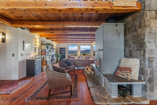 125 Rocky Mountain Mdws, Bozeman, MT 59715 - living area featuring hardwood / wood-style flooring, wooden ceiling with exposed beams, and a lit fireplace