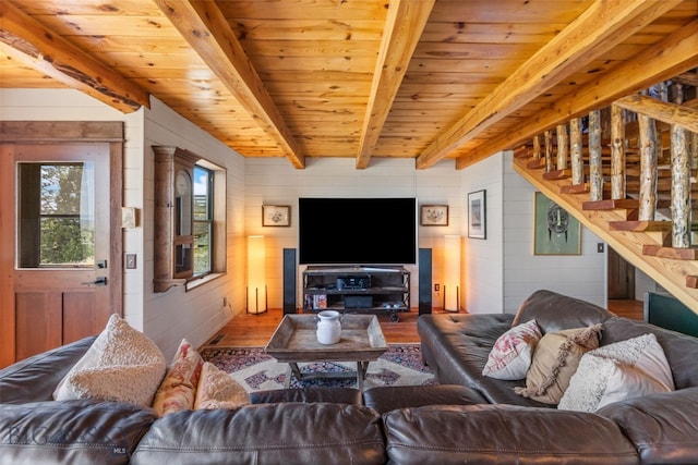 125 Rocky Mountain Mdws, Bozeman, MT 59715 - living area with wood finished floors, wood ceiling with exposed beams, wooden walls, and stairway