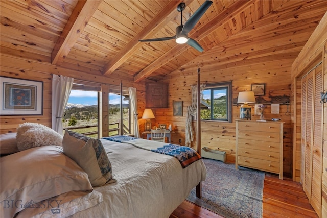 125 Rocky Mountain Mdws, Bozeman, MT 59715 - bedroom with wooden ceiling, multiple windows, wood walls, access to outside, and hardwood / wood-style flooring