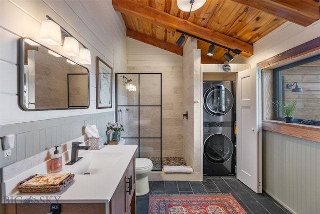 125 Rocky Mountain Mdws, Bozeman, MT 59715 - bathroom featuring estacked washer and dryer, wood ceiling, a shower stall, vanity, and toilet