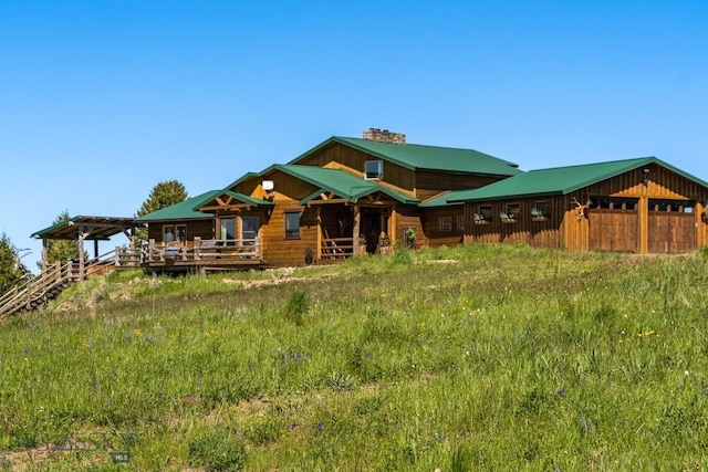 125 Rocky Mountain Mdws, Bozeman, MT 59715 - rear view of property with a chimney