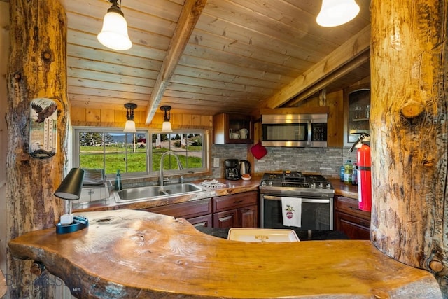 125 Rocky Mountain Mdws, Bozeman, MT 59715 - kitchen featuring appliances with stainless steel finishes, a sink, wood ceiling, decorative backsplash, and wooden counters
