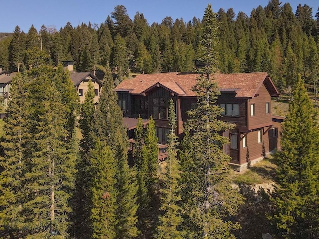 102 Outlook Trl, Big Sky, MT 59716 - aerial view of property and surrounding area featuring a heavily wooded area