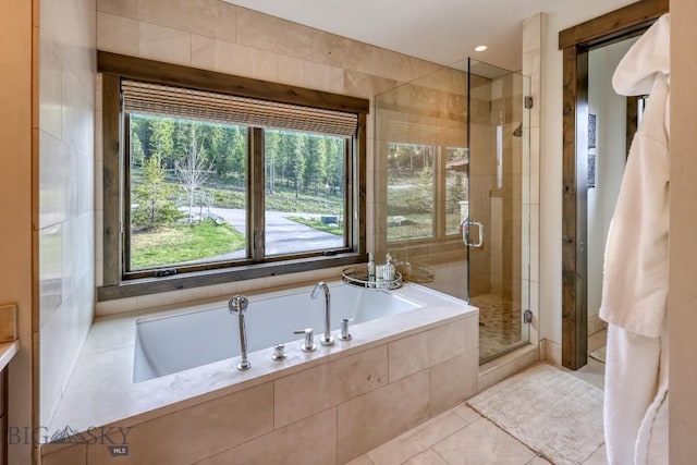 102 Outlook Trl, Big Sky, MT 59716 - bathroom featuring a shower stall, a garden tub, and tile patterned floors