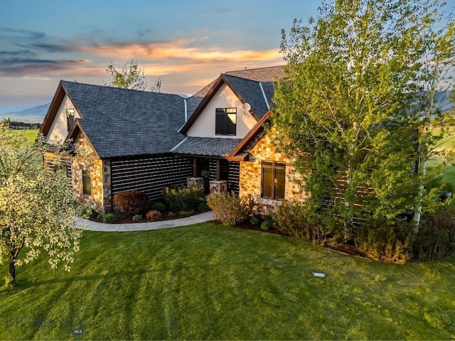 306 Glenbrook Ln, Belgrade, MT 59714 - log-style house with stone siding, a front lawn, and a shingled roof