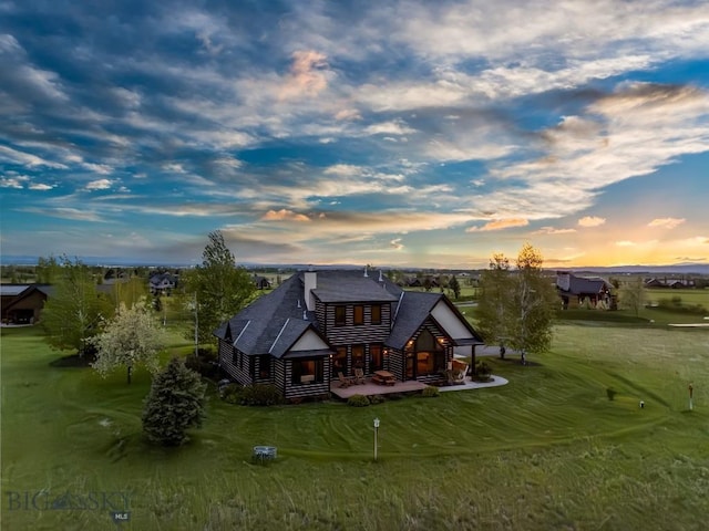 306 Glenbrook Ln, Belgrade, MT 59714 - rear view of property with a lawn