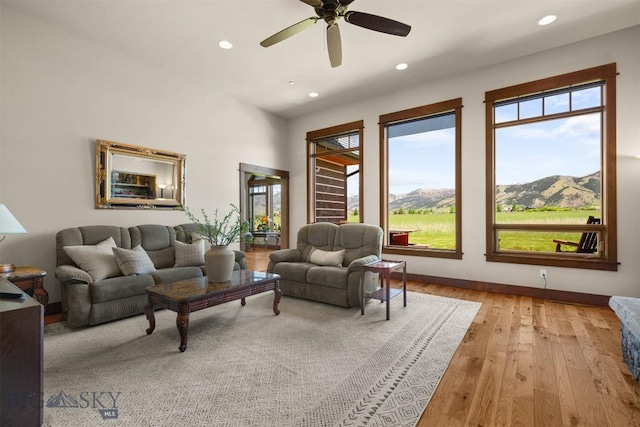 306 Glenbrook Ln, Belgrade, MT 59714 - living area with recessed lighting, light wood finished floors, a ceiling fan, a mountain view, and baseboards