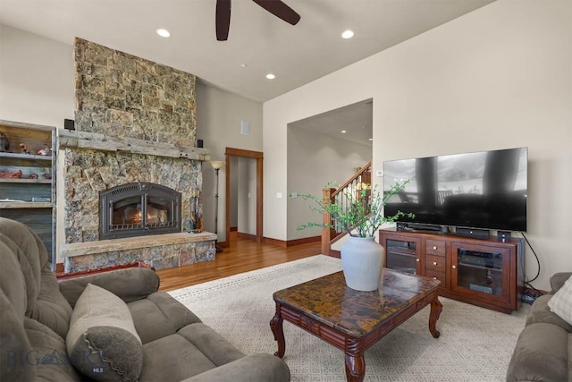 306 Glenbrook Ln, Belgrade, MT 59714 - living room featuring a ceiling fan, a fireplace, wood finished floors, stairs, and recessed lighting