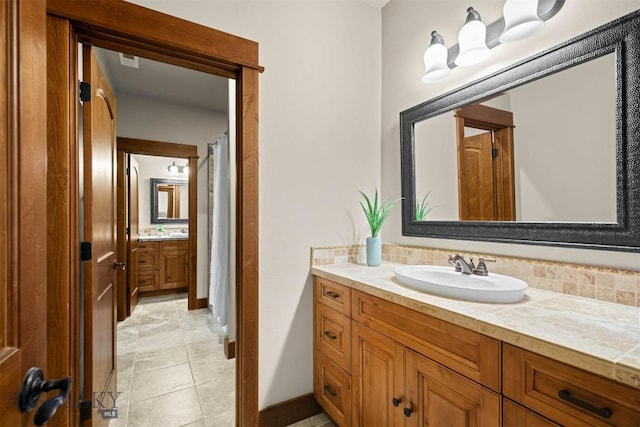 306 Glenbrook Ln, Belgrade, MT 59714 - full bath featuring vanity, baseboards, and tile patterned floors