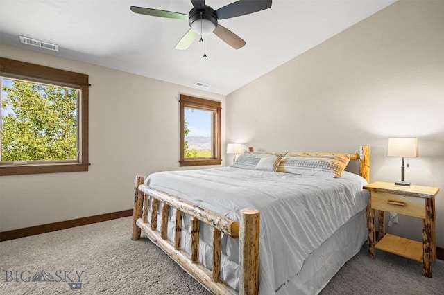 306 Glenbrook Ln, Belgrade, MT 59714 - bedroom with carpet floors, multiple windows, baseboards, lofted ceiling, and ceiling fan