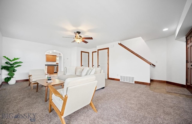4068 Opal St, Bozeman, MT 59718 - carpeted living area featuring ceiling fan, baseboards, stairway, and arched walkways