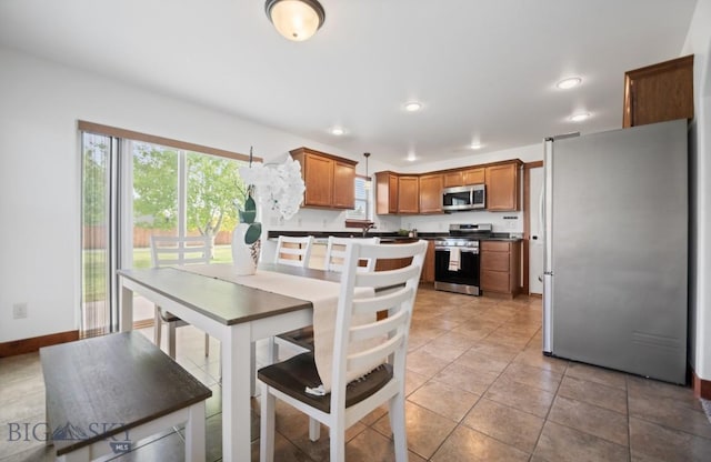4068 Opal St, Bozeman, MT 59718 - dining room with recessed lighting, light tile patterned flooring, and baseboards