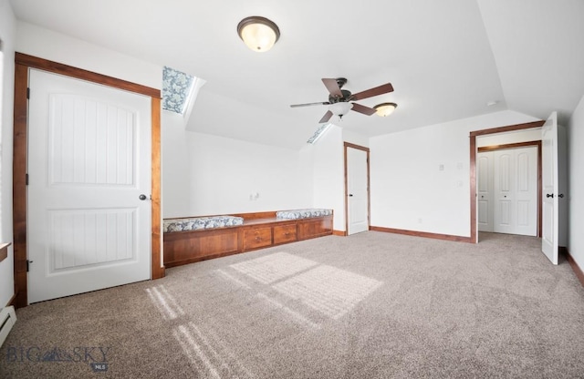 4068 Opal St, Bozeman, MT 59718 - unfurnished bedroom with carpet, vaulted ceiling, baseboards, and baseboard heating
