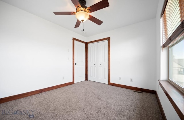 4068 Opal St, Bozeman, MT 59718 - carpeted empty room featuring plenty of natural light, baseboards, and a ceiling fan