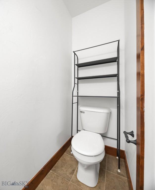 4068 Opal St, Bozeman, MT 59718 - bathroom with baseboards, toilet, and tile patterned floors