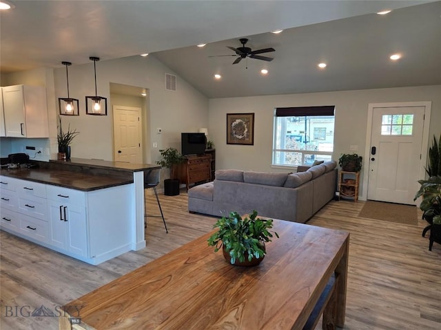 108 E 9th Ave, Twin Bridges, MT 59754 - dining space featuring vaulted ceiling, light wood-style floors, ceiling fan, and recessed lighting