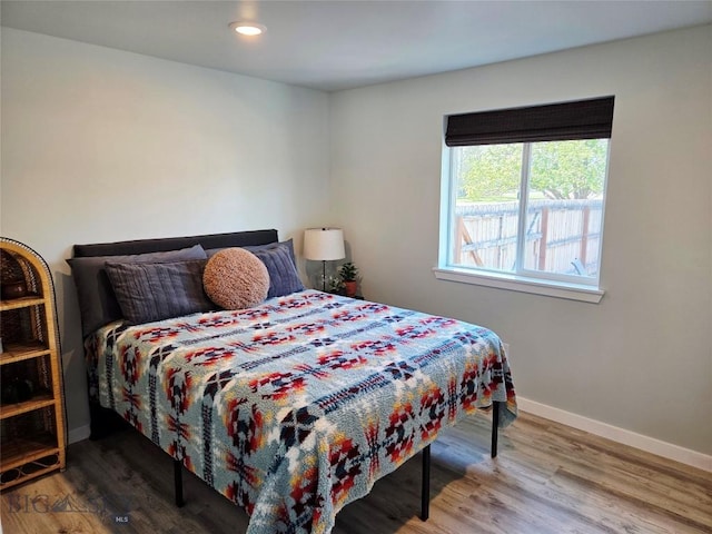 108 E 9th Ave, Twin Bridges, MT 59754 - bedroom featuring baseboards, wood finished floors, and recessed lighting