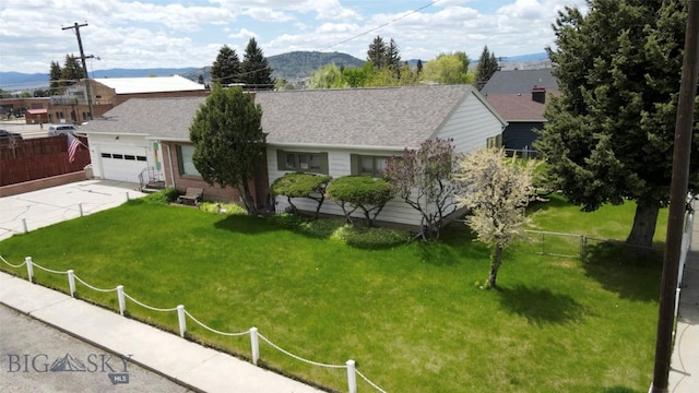 2301 Banks Ave, Butte, MT 59701 - single story home with concrete driveway, a garage, a mountain view, and roof with shingles