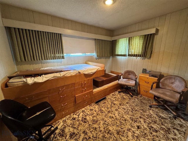 2301 Banks Ave, Butte, MT 59701 - bedroom featuring a textured ceiling, wood walls, and multiple windows