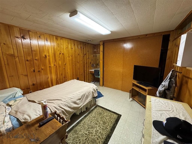 2301 Banks Ave, Butte, MT 59701 - bedroom featuring light flooring and wooden walls