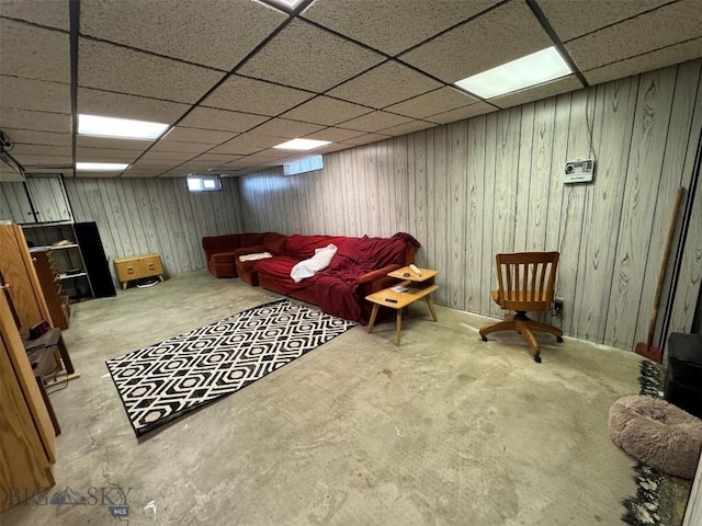 2301 Banks Ave, Butte, MT 59701 - living room with a drop ceiling, concrete flooring, and wood walls