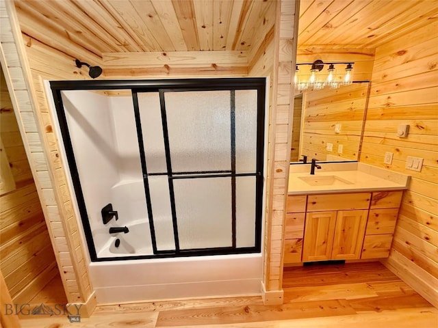 14 Ken Dan, Mcleod, MT 59052 - full bath with wood ceiling, wood walls, vanity, wood finished floors, and enclosed tub / shower combo