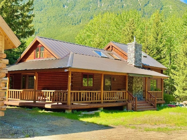 14 Ken Dan, Mcleod, MT 59052 - back of property with covered porch, a forest view, and metal roof