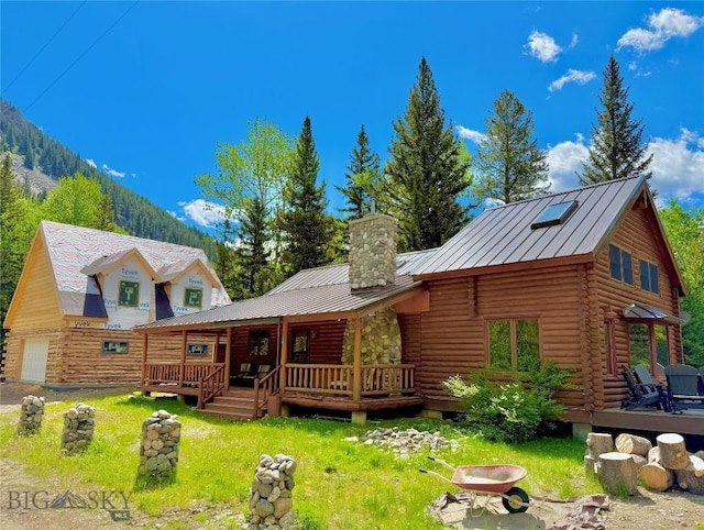 14 Ken Dan, Mcleod, MT 59052 - rear view of house featuring log siding, a chimney, metal roof, a porch, and a standing seam roof