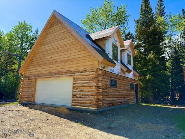 14 Ken Dan, Mcleod, MT 59052 - view of property exterior featuring log siding and a detached garage