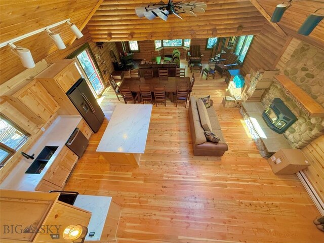 14 Ken Dan, Mcleod, MT 59052 - living area featuring wood-type flooring, a high ceiling, and log walls
