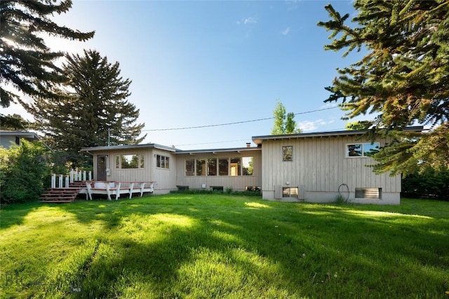 1524 S Grand, Bozeman, MT 59715 - rear view of house with a wooden deck and a yard