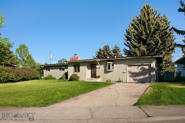 1524 S Grand, Bozeman, MT 59715 - single story home with a garage, a chimney, a front yard, concrete driveway, and board and batten siding